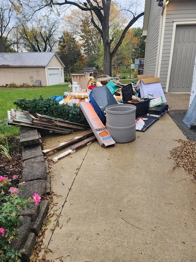 Dumpster being loaded with debris for 30 Yard Dumpster Rental in Glendale